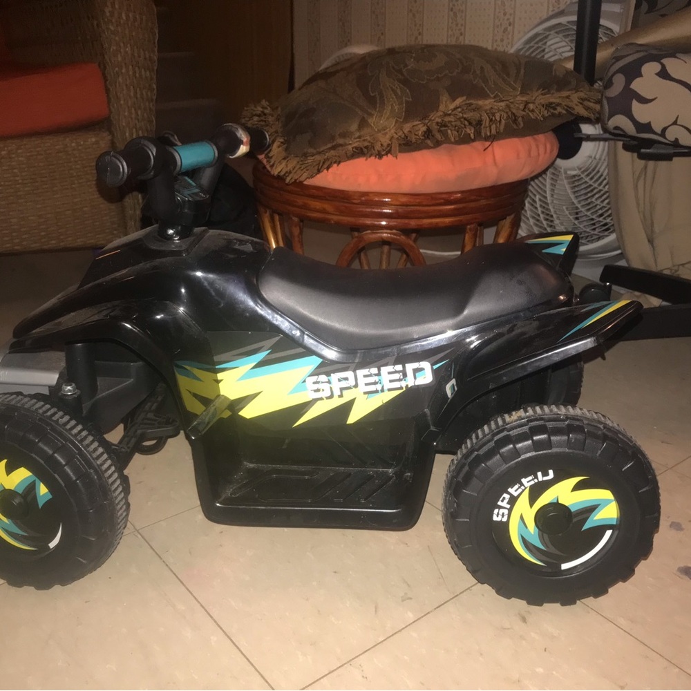 Black and Yellow Electric Quad Bike with Large Wheels and Sturdy Body